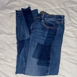 Dark blue patched skinny jeans.